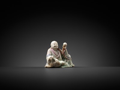 Lot 298 - A BAIFURONG SOAPSTONE FIGURE OF XIAOSHI LUOHAN WITH A BUDDHIST LION, 17TH-18TH CENTURY