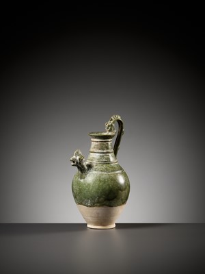 Lot 354 - A GREEN GLAZED ‘CHICKEN HEAD’ EWER, TANG TO LIAO DYNASTY