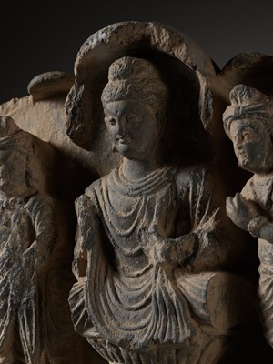Lot 231 - A GRAY SCHIST GABLE OF BUDDHA SURROUNDED BY HIS DISCIPLES, KUSHAN PERIOD