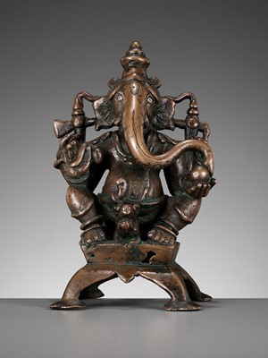 Lot 246 - A SILVER-INLAID COPPER ALLOY FIGURE OF GANESHA, SOUTH INDIA, C. 1650-1750