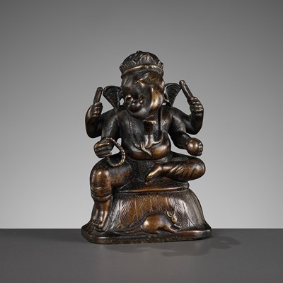 Lot 689 - A SMALL BRONZE FIGURE OF GANESHA, SOUTH INDIA, 17TH - 18TH CENTURY