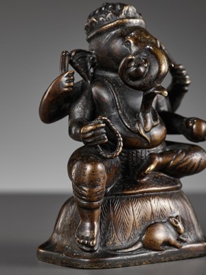 Lot 689 - A SMALL BRONZE FIGURE OF GANESHA, SOUTH INDIA, 17TH - 18TH CENTURY