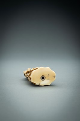 Lot 718 - AN IVORY NETSUKE-OKIMONO OF SEVERAL TENGU IN A FIGHT, MEIJI