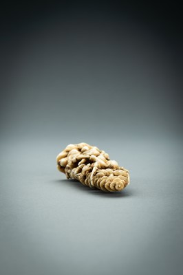 Lot 718 - AN IVORY NETSUKE-OKIMONO OF SEVERAL TENGU IN A FIGHT, MEIJI