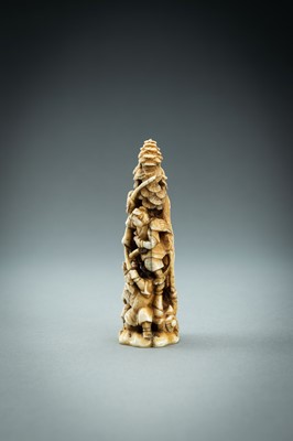 Lot 718 - AN IVORY NETSUKE-OKIMONO OF SEVERAL TENGU IN A FIGHT, MEIJI