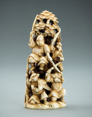 Lot 718 - AN IVORY NETSUKE-OKIMONO OF SEVERAL TENGU IN A FIGHT, MEIJI