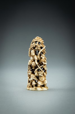 Lot 718 - AN IVORY NETSUKE-OKIMONO OF SEVERAL TENGU IN A FIGHT, MEIJI