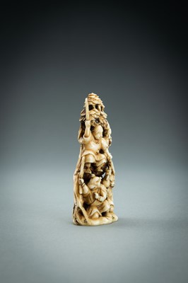 Lot 718 - AN IVORY NETSUKE-OKIMONO OF SEVERAL TENGU IN A FIGHT, MEIJI