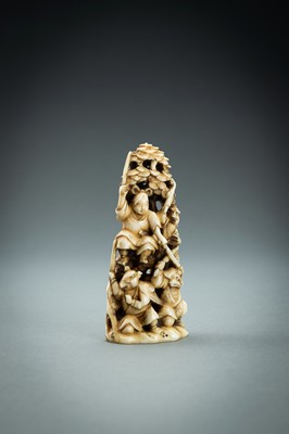 Lot 718 - AN IVORY NETSUKE-OKIMONO OF SEVERAL TENGU IN A FIGHT, MEIJI