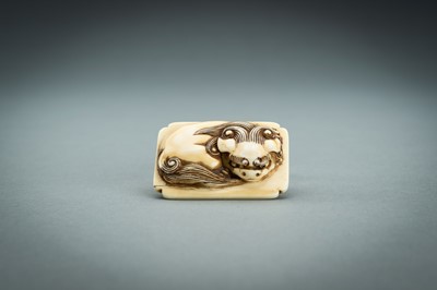 Lot 312 - A RENSAI STYLE IVORY NETSUKE OF A SHISHI, MEIJI