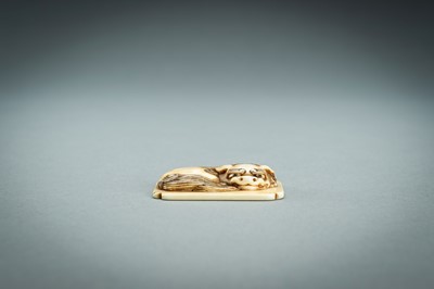 Lot 312 - A RENSAI STYLE IVORY NETSUKE OF A SHISHI, MEIJI
