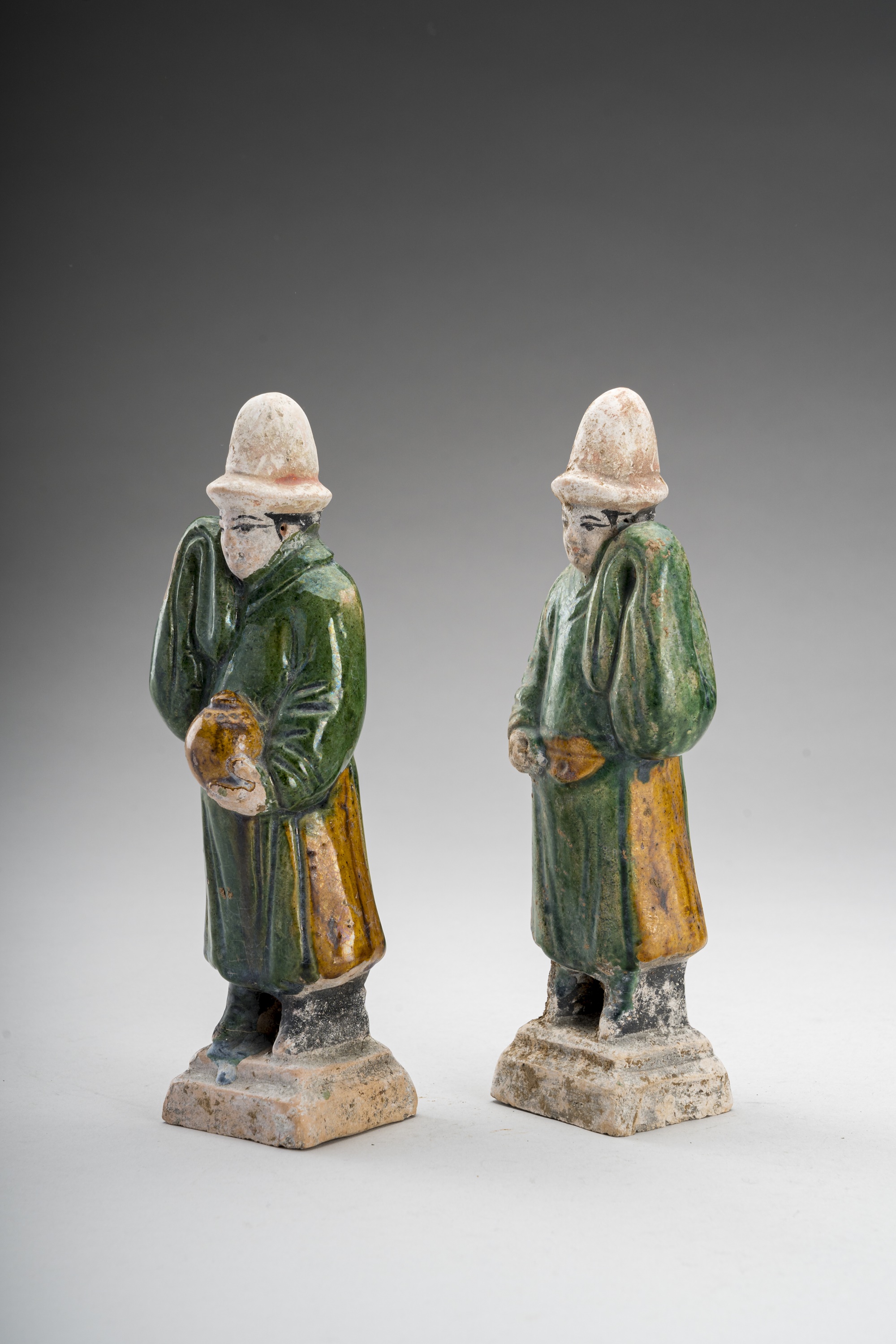 Lot 558 - TWO SANCAI-GLAZED POTTERY FIGURES OF