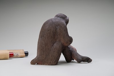 Lot 256 - A RARE AND LARGE PAINTED POTTERY OKIMONO OF A MONKEY EXAMINING A MONKEY NETSUKE