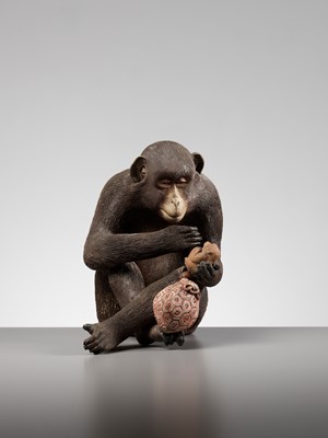 Lot 256 - A RARE AND LARGE PAINTED POTTERY OKIMONO OF A MONKEY EXAMINING A MONKEY NETSUKE