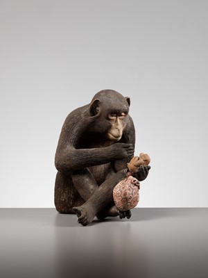 Lot 256 - A RARE AND LARGE PAINTED POTTERY OKIMONO OF A MONKEY EXAMINING A MONKEY NETSUKE