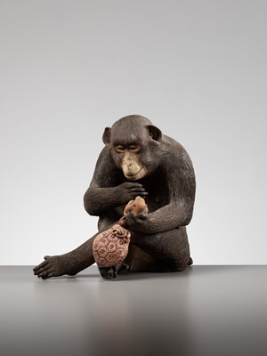 Lot 256 - A RARE AND LARGE PAINTED POTTERY OKIMONO OF A MONKEY EXAMINING A MONKEY NETSUKE