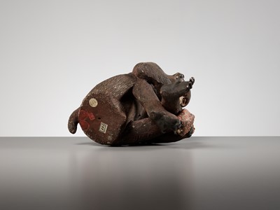 Lot 256 - A RARE AND LARGE PAINTED POTTERY OKIMONO OF A MONKEY EXAMINING A MONKEY NETSUKE
