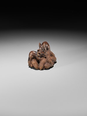 Lot 89 - MASANAO: A WOOD NETSUKE OF TWO RATS ON A CLUSTER OF PEANUTS