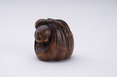 Lot 372 - A WOOD NETSUKE OF HOTEI AND A BOY INSIDE HIS TREASURE BAG