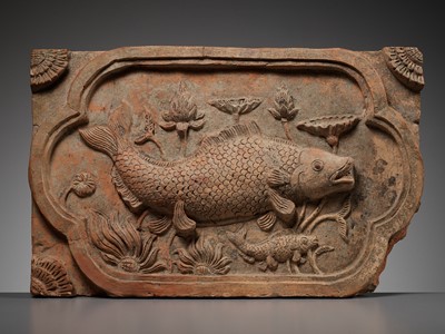 Lot 379 - A RED POTTERY ‘DOUBLE FISH’ TILE, SECOND HALF OF THE MING DYNASTY