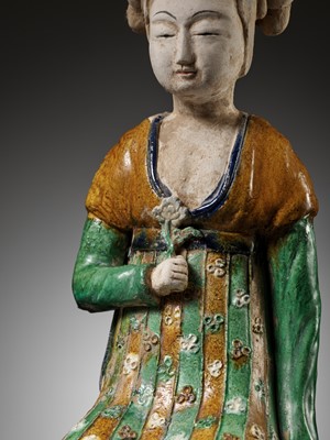Lot 1192 - A RARE SANCAI-GLAZED POTTERY FIGURE OF A SEATED COURT LADY, TANG DYNASTY OR LATER