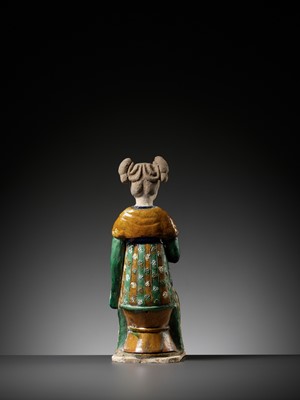 Lot 1192 - A RARE SANCAI-GLAZED POTTERY FIGURE OF A SEATED COURT LADY, TANG DYNASTY OR LATER
