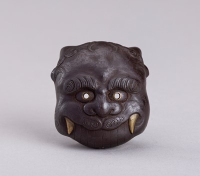 Lot 827 - HARUAKI (SHUNMEI): A RARE IRON MASK NETSUKE OF AN ONI, 19TH CENTURY