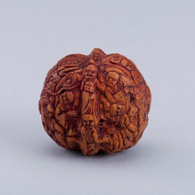 A WALNUT CARVING WITH BLIND MEN