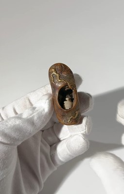 Lot 291 - TOYO: A RARE AND UNUSUAL LACQUERED ROOT WOOD NETSUKE OF A SNAKE INSIDE A PINE TREE