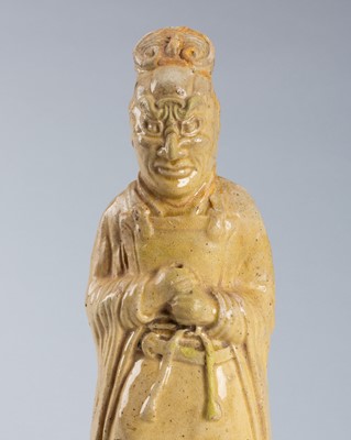 Lot 1193 - A STRAW GLAZED POTTERY FIGURE OF A TOMB GUARDIAN, SUI TO TANG DYNASTY