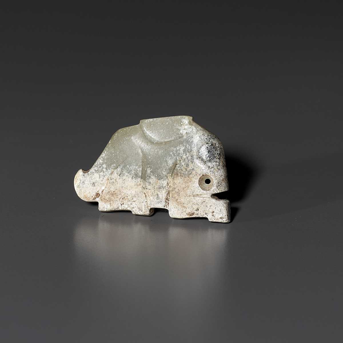Lot 28 - A PALE CELADON JADE ‘HARE’ PENDANT, LATE SHANG TO WESTERN ZHOU DYNASTY