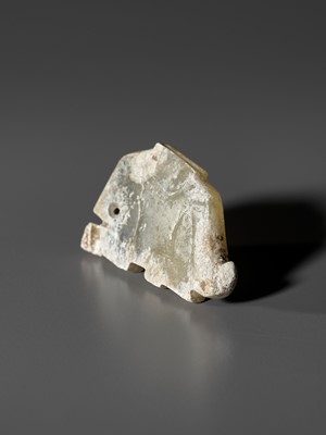 Lot 28 - A PALE CELADON JADE ‘HARE’ PENDANT, LATE SHANG TO WESTERN ZHOU DYNASTY