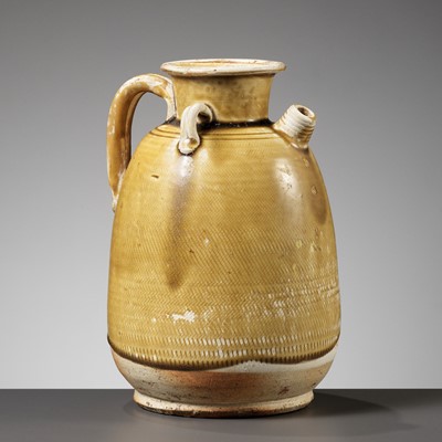 Lot 352 - AN AMBER GLAZED ‘HATCHED’ EWER, TANG DYNASTY