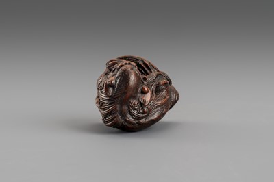 Lot 307 - MASATOMO: A BOXWOOD NETSUKE OF A SHISHI LION, EDO PERIOD