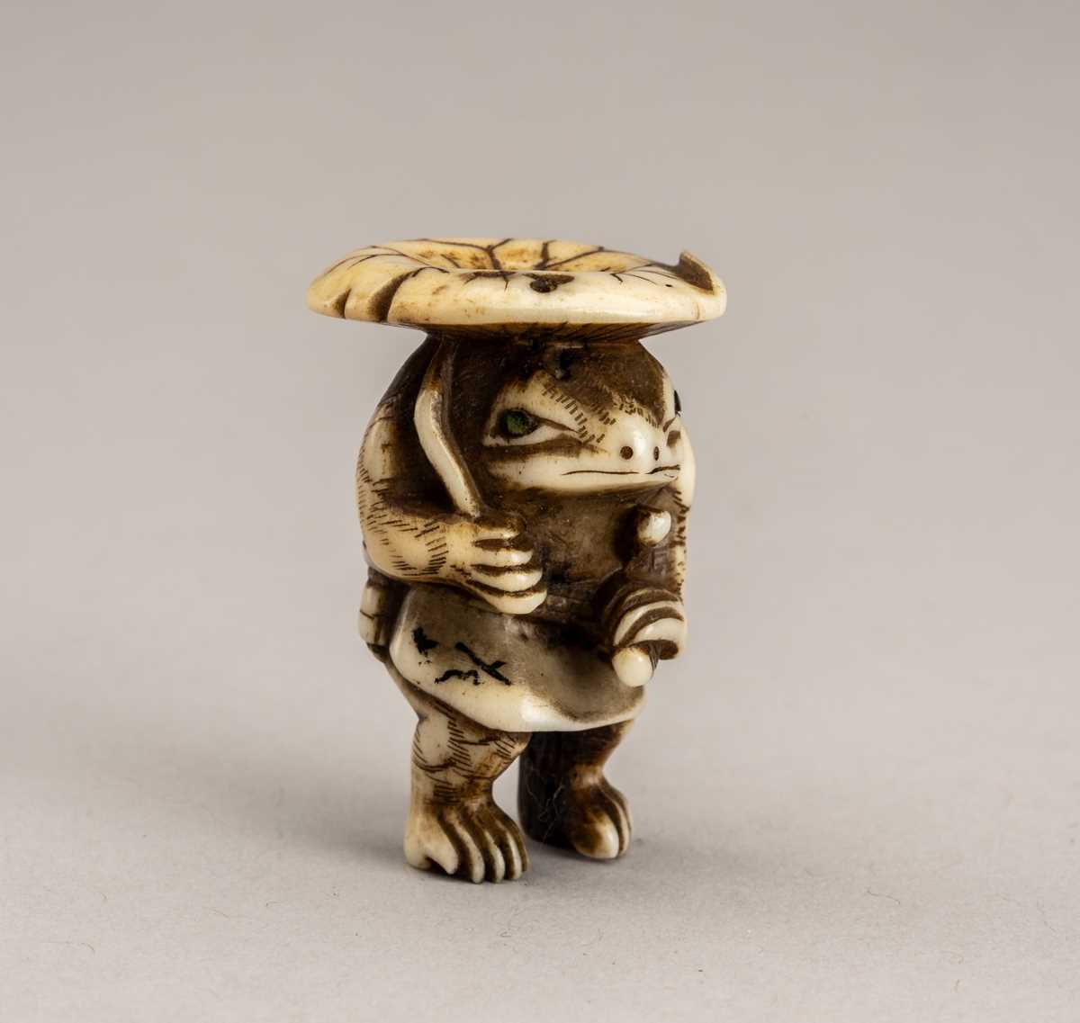 Lot 759 - HARUOKI: A STAG ANTLER NETSUKE OF A FROG