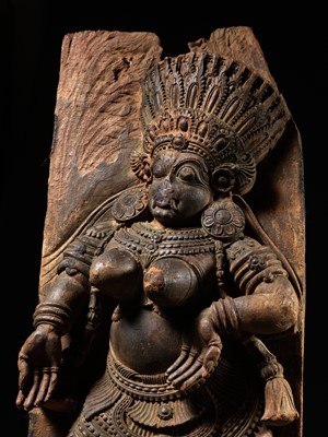 Lot 691 - A LARGE AND HIGHLY IMPRESSIVE WOOD RELIEF OF A DANCING FEMALE DEMON, KERALA, SOUTH INDIA, 17TH CENTURY