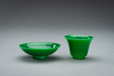 AN APPLE GREEN GLASS CUP AND SAUCER