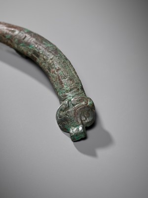 Lot 463 - A PAIR OF ‘DRAGON AND TAOTIE MASK’ BRONZE CHEEK-PIECE FITTINGS, ZHOU DYNASTY