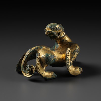 Lot 379 - A GILT BRONZE ‘TIGER’ BRUSH REST, HAN DYNASTY