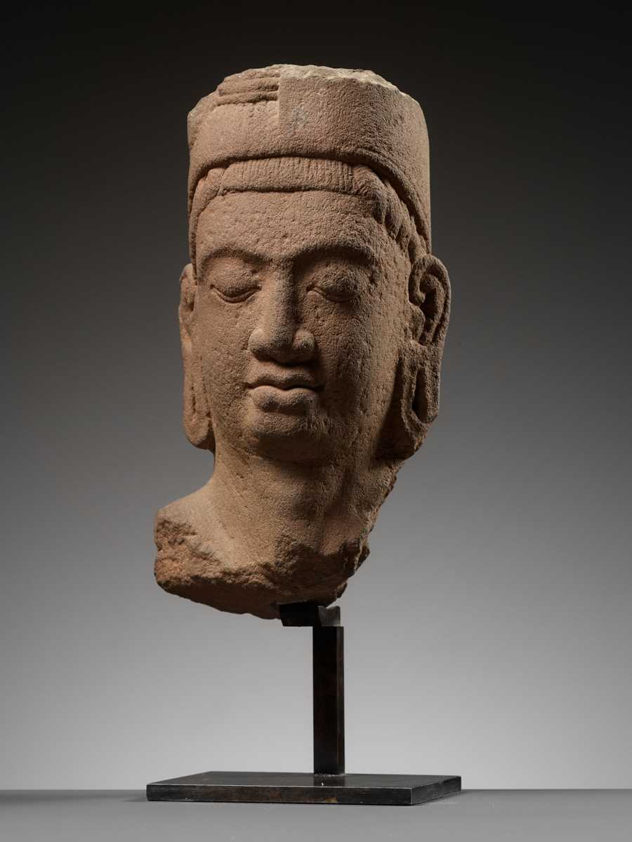 Lot 622 - A SANDSTONE HEAD OF HARIHARA, PRE-ANGKOR