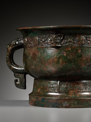 Lot 121 - A ‘FIRE AND FOUR-PETAL LEAVES’ BRONZE RITUAL FOOD VESSEL, GUI, EARLY WESTERN ZHOU DYNASTY