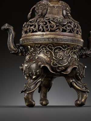 Lot 154 - AN INLAID BRONZE ‘ELEPHANT’ TRIPOD CENSER AND OPENWORK COVER, 18TH CENTURY