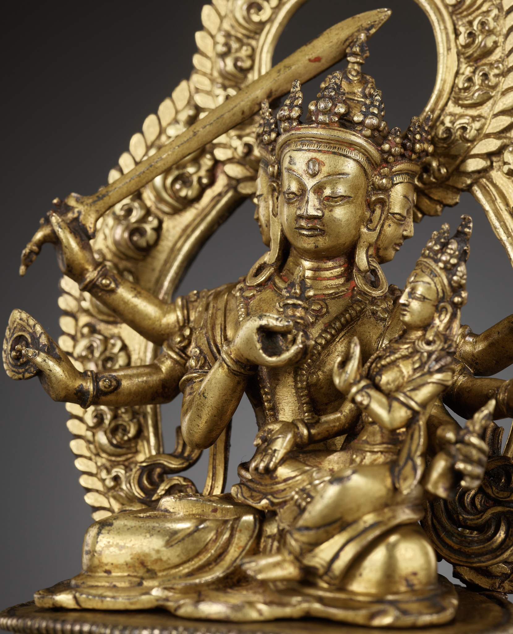 Lot 181 - A GILT BRONZE FIGURE OF SADBHUJA MANJUSRI,