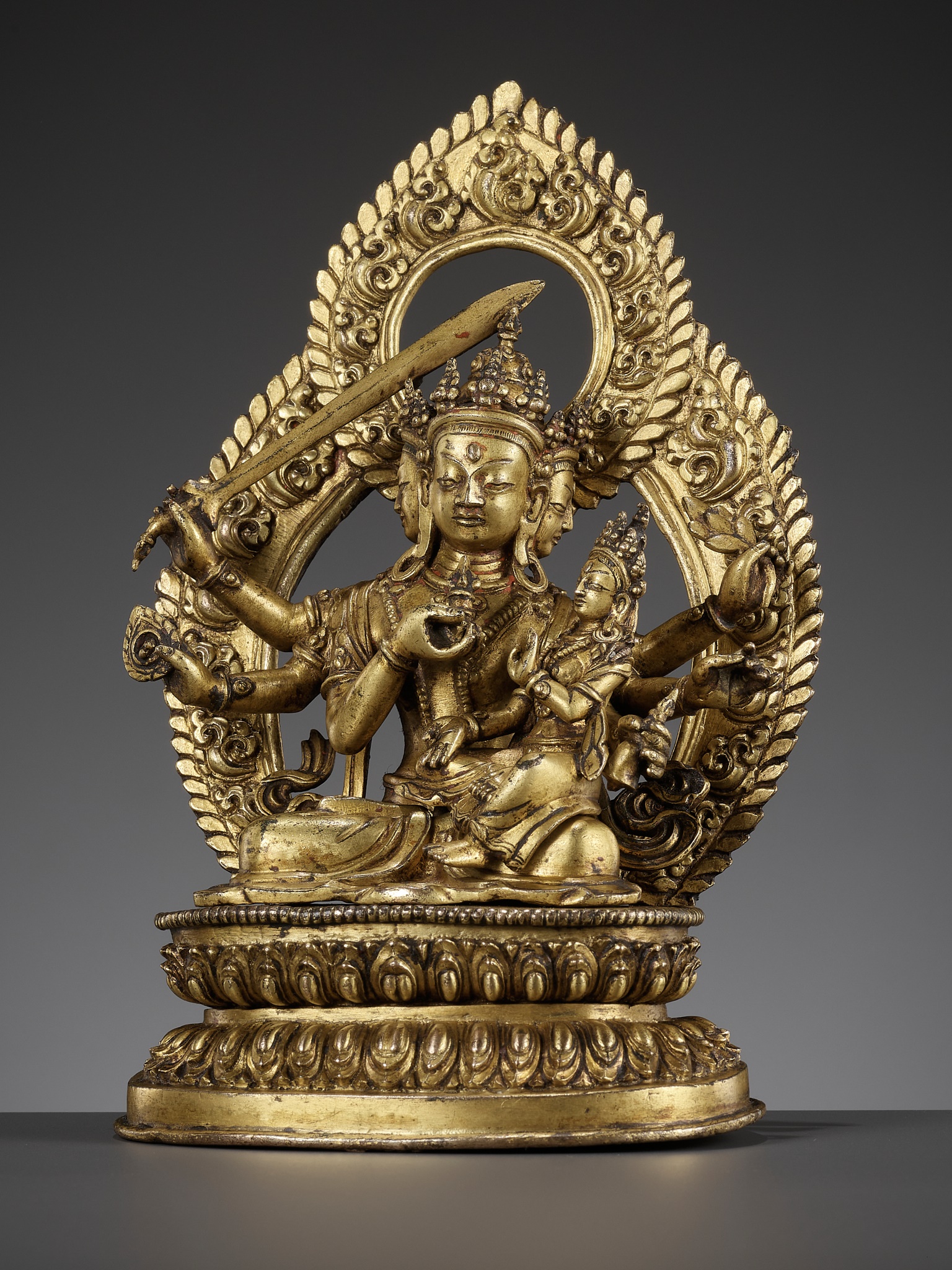 Lot 181 - A GILT BRONZE FIGURE OF SADBHUJA MANJUSRI,