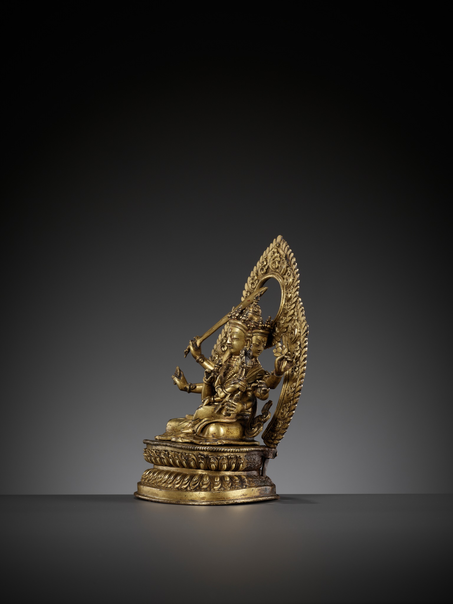 Lot 181 - A GILT BRONZE FIGURE OF SADBHUJA MANJUSRI,