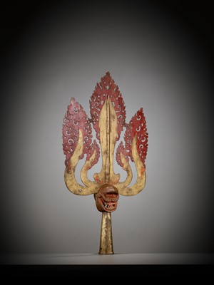 Lot 198 - A LARGE LACQUERED AND GILT COPPER-ALLOY TRISHULA FITTING, TIBET, 17TH - 18TH CENTURY