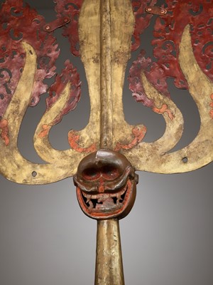 Lot 198 - A LARGE LACQUERED AND GILT COPPER-ALLOY TRISHULA FITTING, TIBET, 17TH - 18TH CENTURY