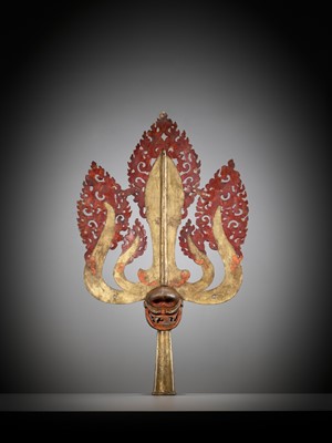 Lot 198 - A LARGE LACQUERED AND GILT COPPER-ALLOY TRISHULA FITTING, TIBET, 17TH - 18TH CENTURY