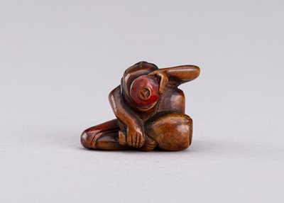 Lot 793 - A WOOD AND NEGORO LACQUER NETSUKE OF A DRUNKARD