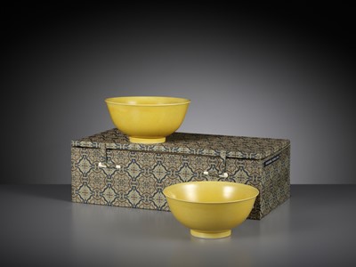 Lot 124 - A NEAR PAIR OF IMPERIAL YELLOW-GLAZED BOWLS, DAOGUANG MARKS AND PERIOD